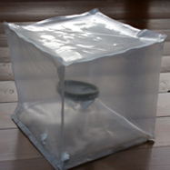 "Ohne Titel", 1998 PVC-Folie, Pappe, Wasserglas B:20cm T:20cm H:20cm